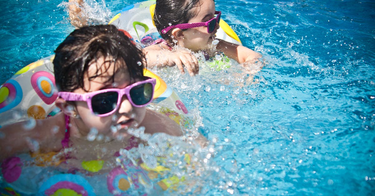 2-girl-s-swimming-during-daytime-1013372