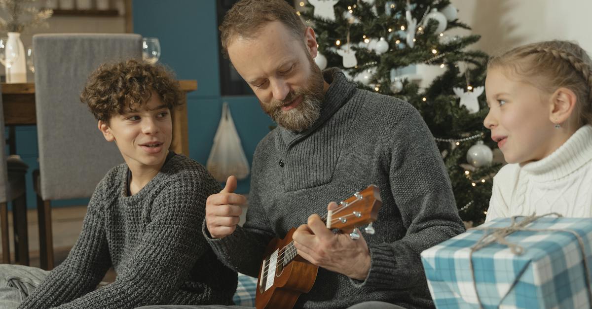 a-father-playing-ukulele-for-the-kids-9375563