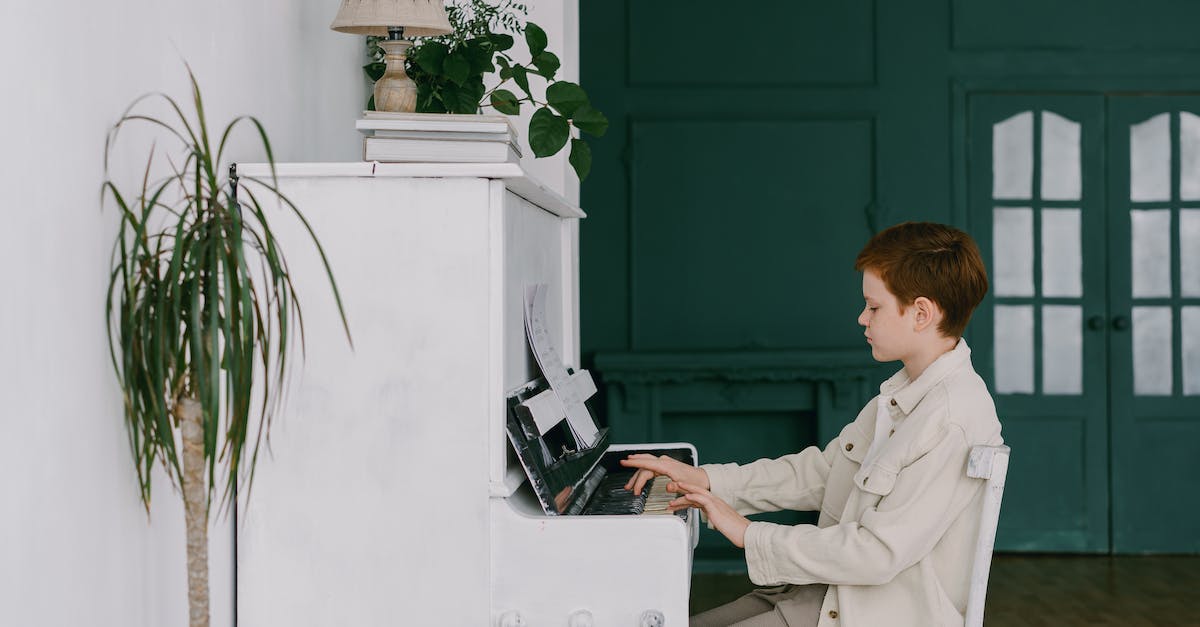 a-young-boy-playing-piano-2468640