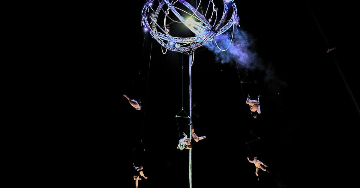 acrobats-performing-on-tower-9974245