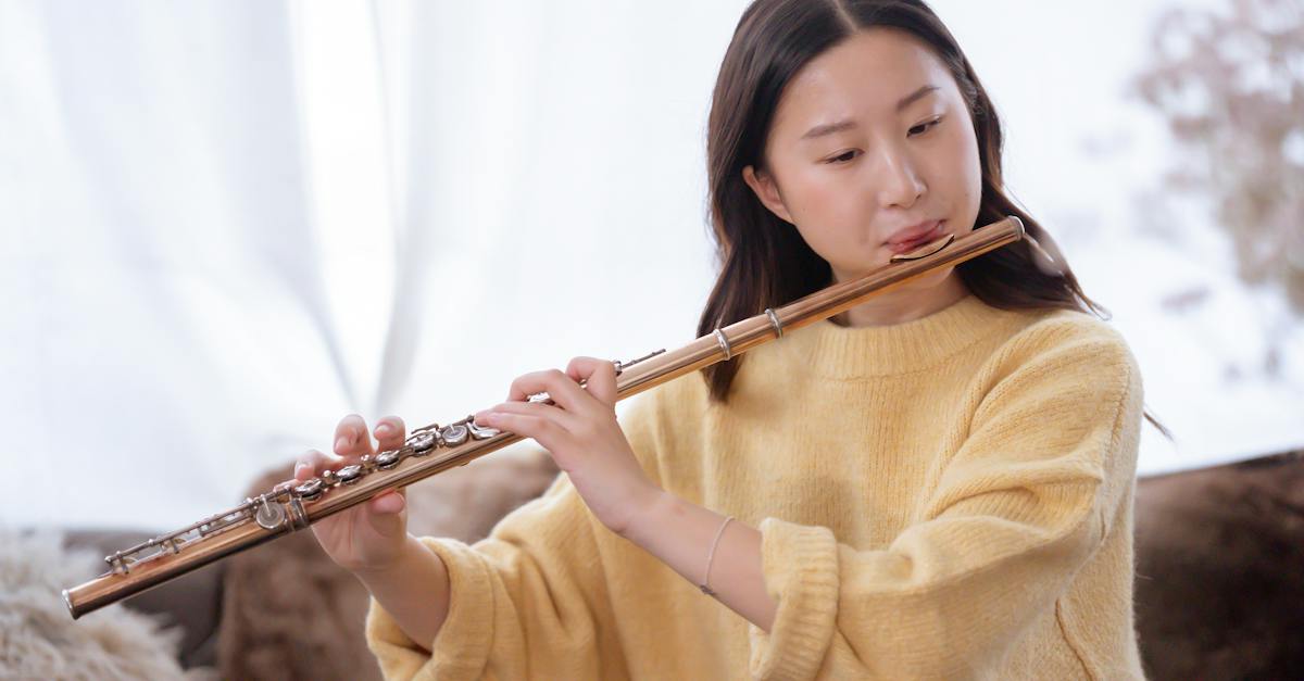 asian-woman-playing-flute-at-home-5022966