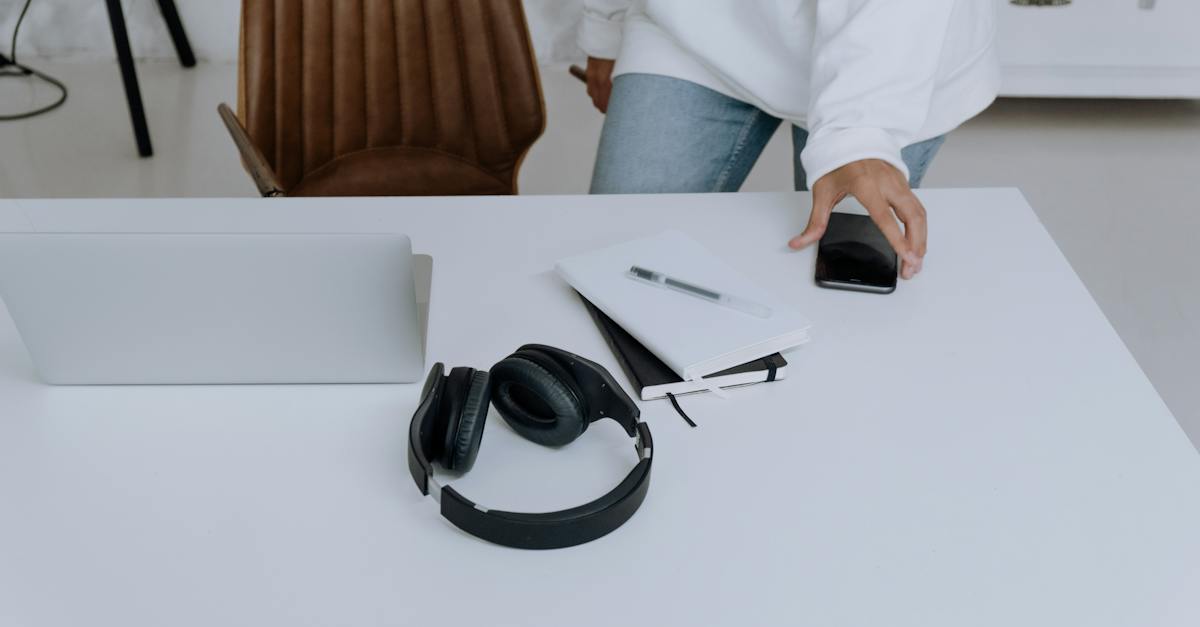 black-and-silver-headphones-on-white-table-5957526