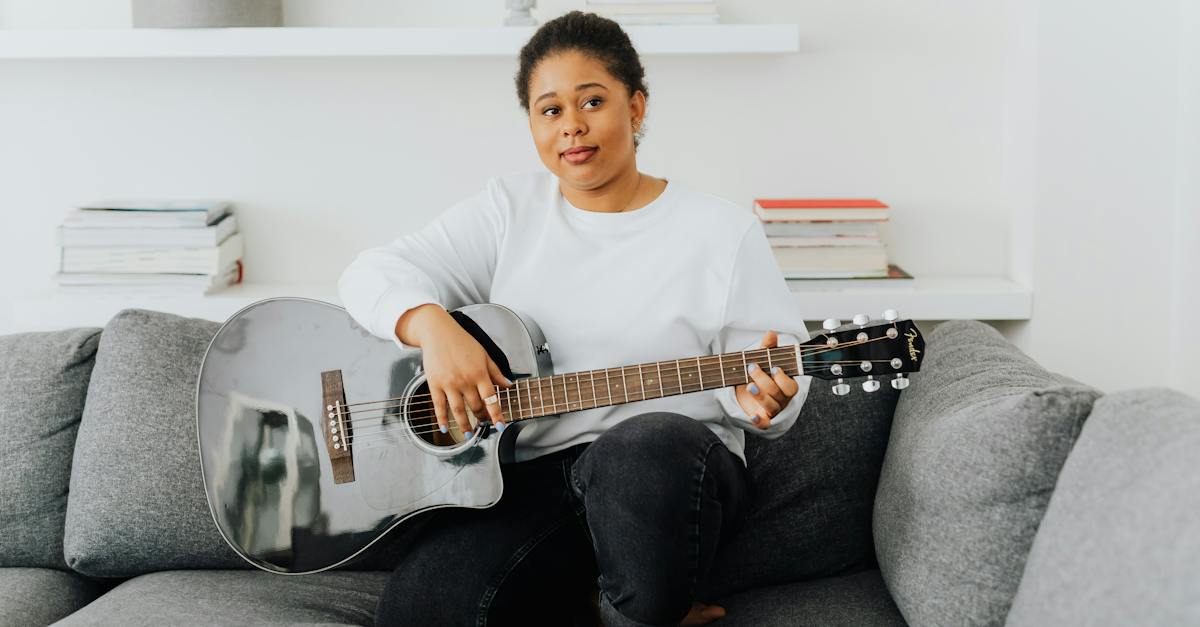 boy-in-white-crew-neck-t-shirt-playing-guitar-7013769