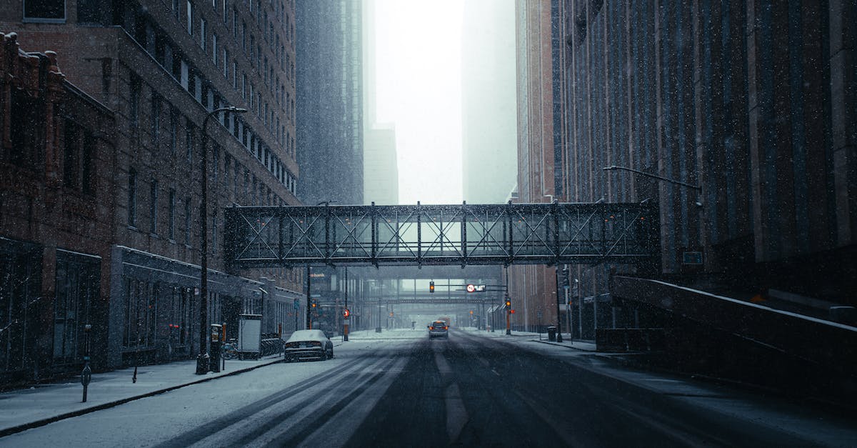 empty-road-between-high-rise-buildings-1179142