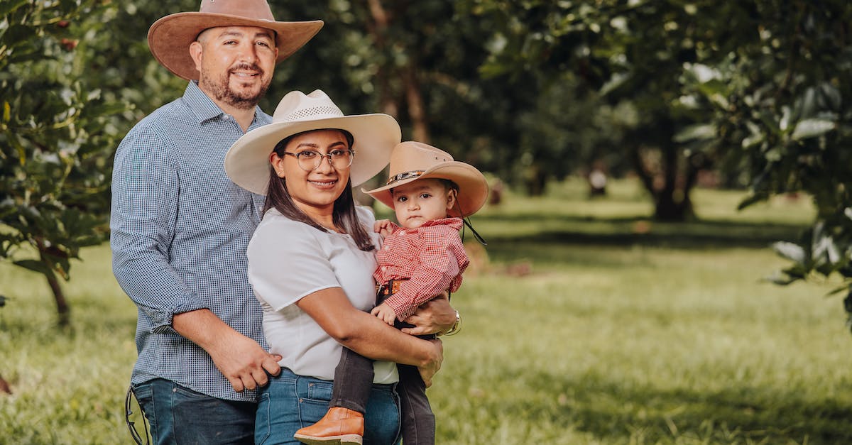family-in-cowboy-hats-smiling-3304340