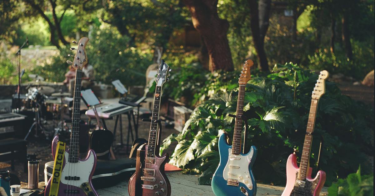 four-electric-guitars-standing-on-a-stage-before-a-concert-in-a-park-7422401