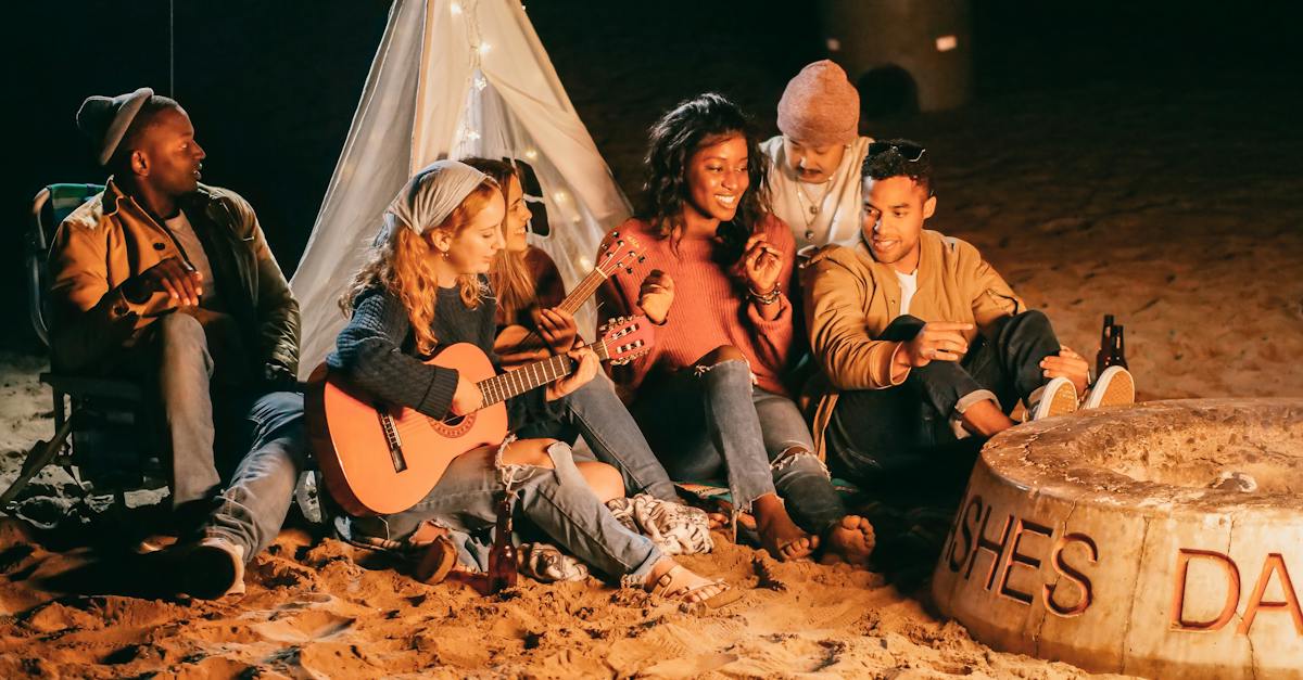 group-of-friends-sitting-on-beach-sand-4199360