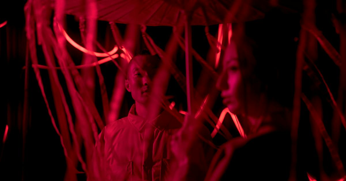 man-and-woman-under-red-light-7409273