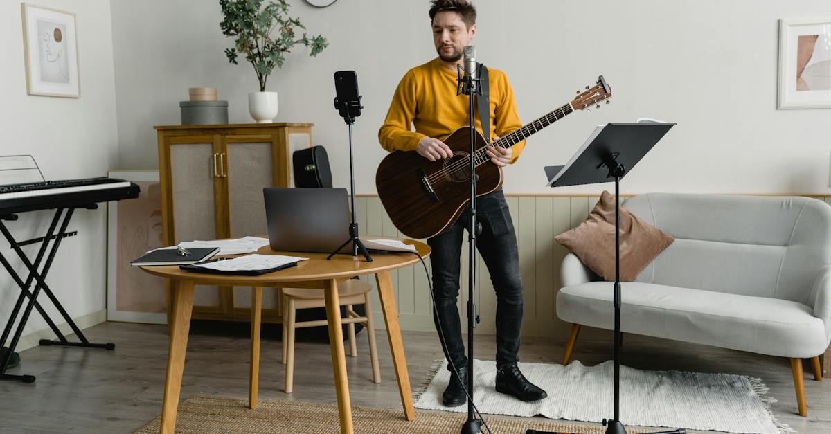 man-filming-himself-while-playing-acoustic-guitar-6232094
