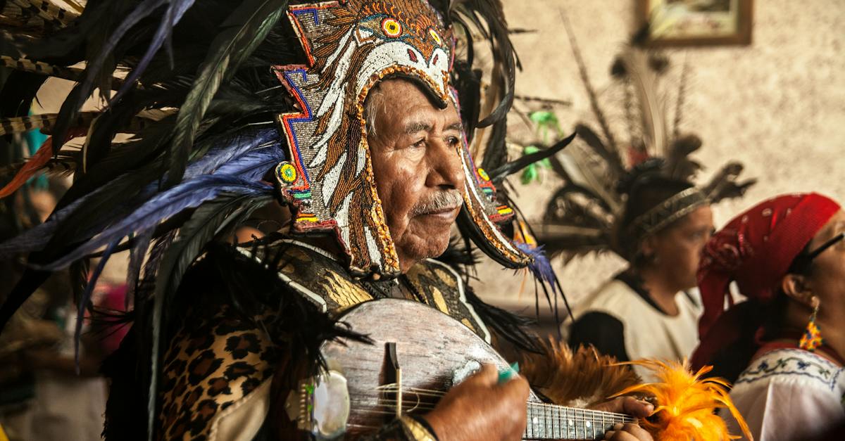 old-man-in-traditional-costume-playing-ukulele-4061138