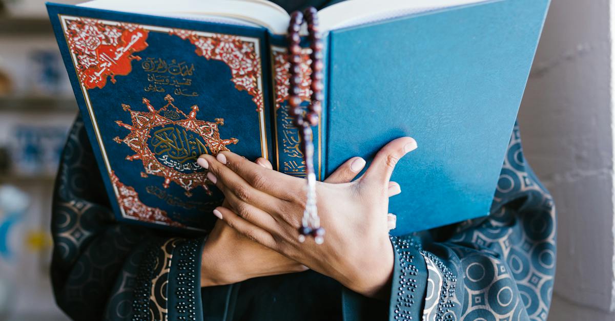 person-holding-blue-holy-book-1230106