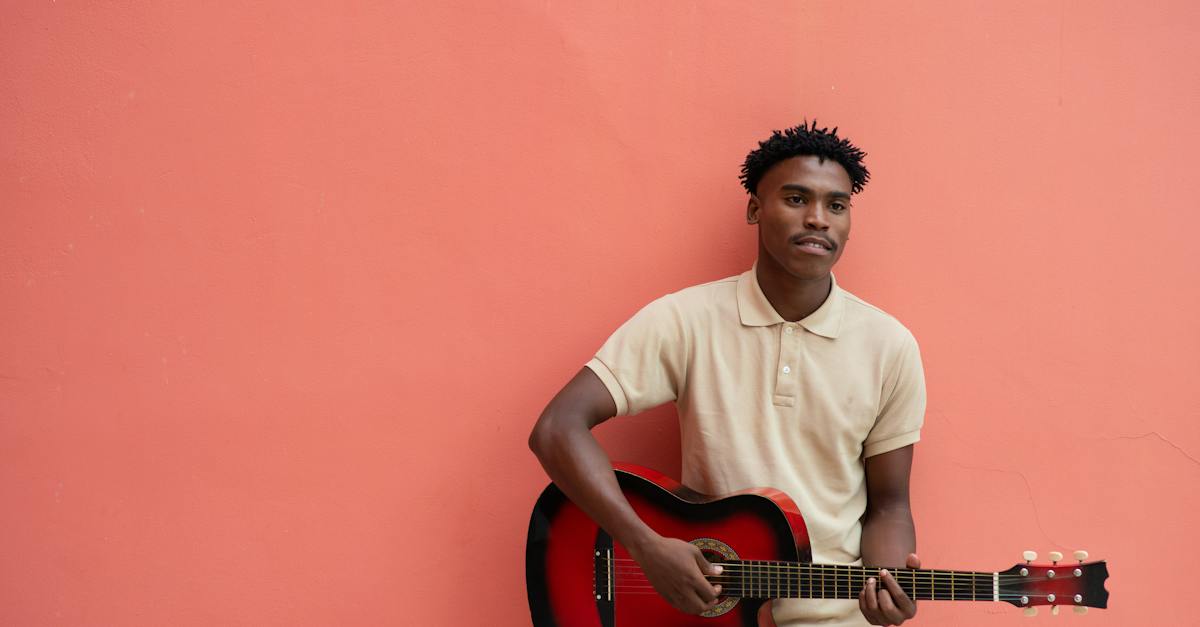 photo-of-man-playing-guitar-9026193