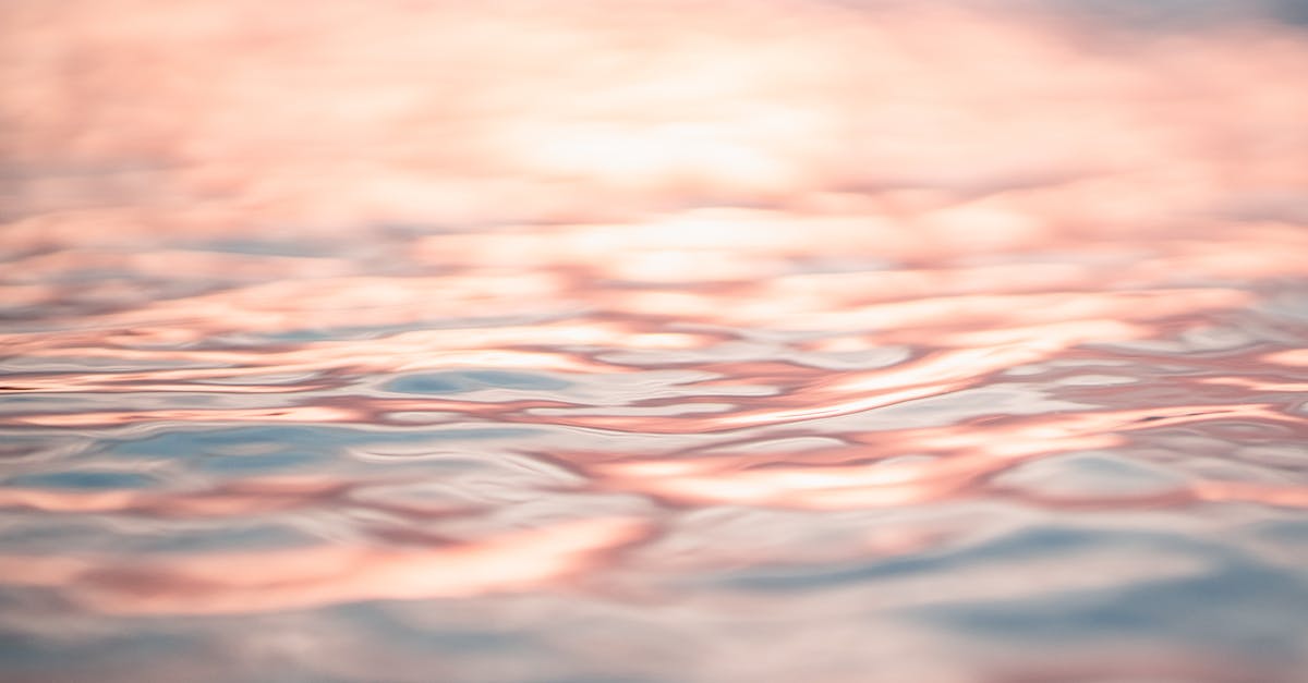 rippling-seawater-reflecting-pink-evening-sky-5264191