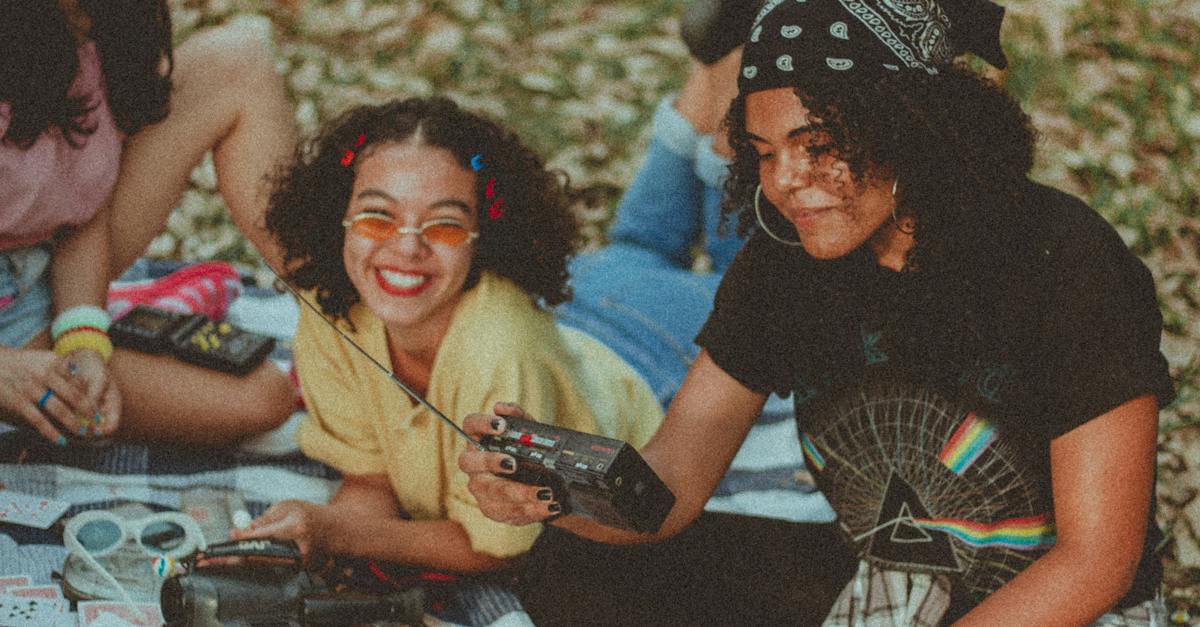 shallow-focus-photo-of-woman-holding-black-am-fm-radio-8723839