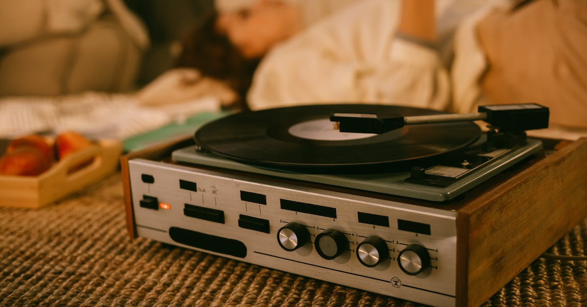 vinyl-record-player-and-women-listening-to-music-in-the-background-3853133