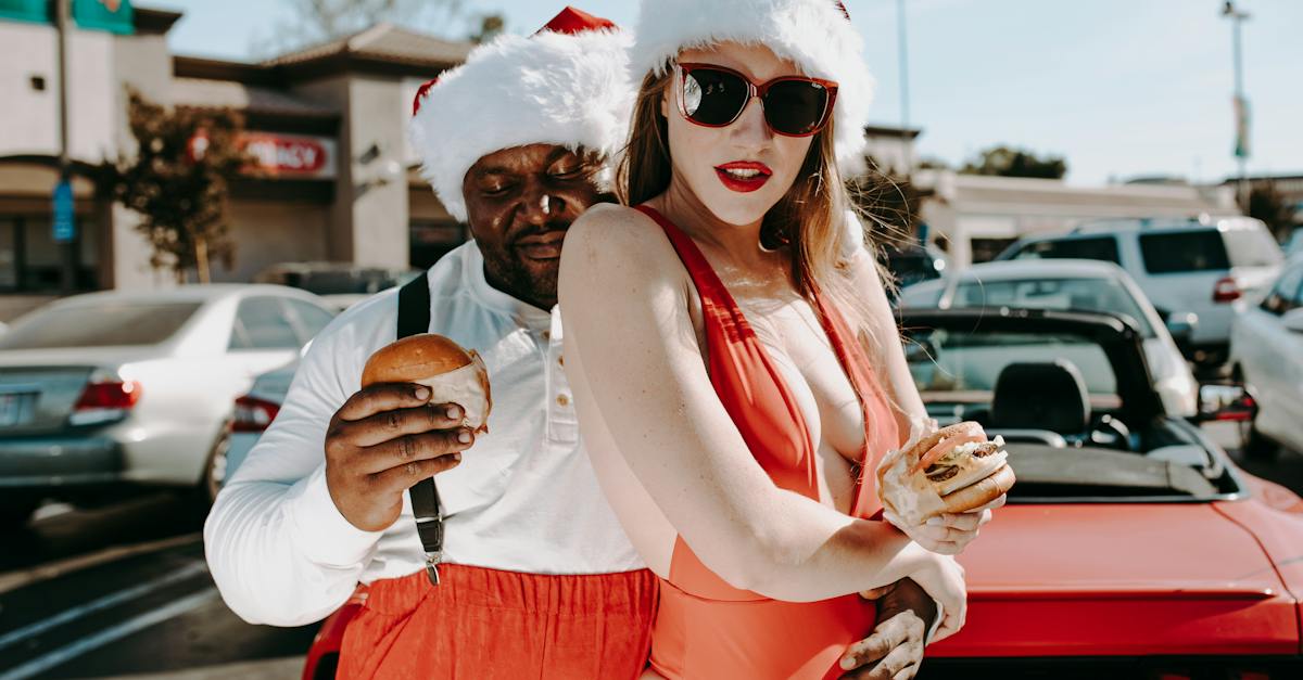 woman-in-white-tank-top-and-red-shorts-wearing-white-sunglasses-holding-ice-cream-7849611